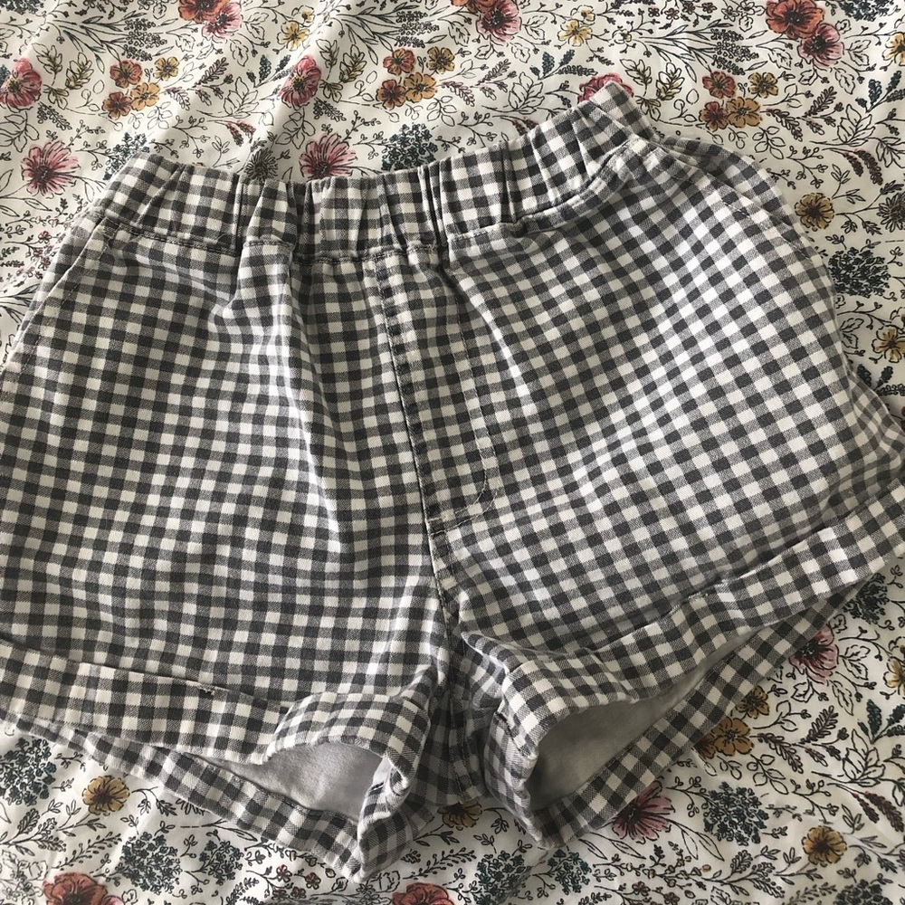 Plaid shorts with rolled up bottoms